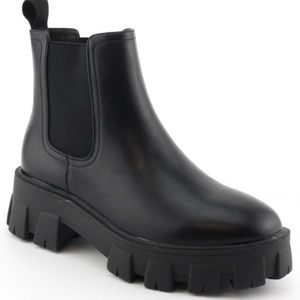 Timeless Elegance:  Show Off Your Style with our must- have solid black boots